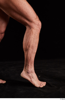 Larry Steel  1 calf flexing nude side view 0006.jpg